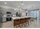 Modern kitchen with gray cabinets and a large island at 5936 High Seas Dr, Orlando, FL 32821