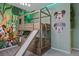 Jungle-themed bedroom with bunk beds and slide at 5936 High Seas Dr, Orlando, FL 32821