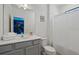 Bathroom with gray vanity, toilet and shower at 5936 High Seas Dr, Orlando, FL 32821