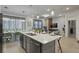 Modern kitchen with large island and stainless steel appliances at 5936 High Seas Dr, Orlando, FL 32821