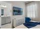 Bedroom with king-size bed, TV, and adjacent bathroom at 5936 High Seas Dr, Orlando, FL 32821