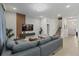 Open concept living room with gray sofa and modern decor at 5936 High Seas Dr, Orlando, FL 32821