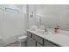 Clean bathroom with a tub and gray vanity at 5936 High Seas Dr, Orlando, FL 32821