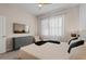 Comfortable bedroom with large TV and dresser at 5936 High Seas Dr, Orlando, FL 32821