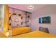 Minion-themed bedroom with twin beds and media at 5936 High Seas Dr, Orlando, FL 32821