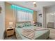 Bright bedroom with a queen-size bed and ensuite bathroom at 5936 High Seas Dr, Orlando, FL 32821