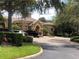 Community entrance with ample parking and landscaping at 6451 Old Park Ln # 110, Orlando, FL 32835