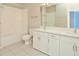 Bright bathroom with double vanity, bathtub, and tile flooring at 6451 Old Park Ln # 110, Orlando, FL 32835