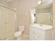 Clean bathroom with white vanity, shower, and toilet at 6451 Old Park Ln # 110, Orlando, FL 32835
