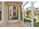 Private screened porch overlooking a lush green landscape at 6451 Old Park Ln # 110, Orlando, FL 32835