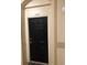 Private condo entrance with a black door and simple design at 6451 Old Park Ln # 110, Orlando, FL 32835