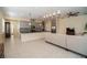Spacious living room with open floor plan and view of kitchen at 4909 W Fountainwood Dr, St Cloud, FL 34772