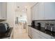 Butler's pantry with granite countertops and modern appliances at 4909 W Fountainwood Dr, St Cloud, FL 34772
