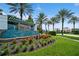 Twin Lakes community entrance with a water feature and lush landscaping at 4909 W Fountainwood Dr, St Cloud, FL 34772