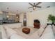 Comfortable living room with sectional sofa and ceiling fan at 4909 W Fountainwood Dr, St Cloud, FL 34772