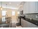 Bright kitchen with gray cabinets, granite countertops and stainless steel appliances at 4909 W Fountainwood Dr, St Cloud, FL 34772