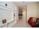 Open living space with built-in shelving and access to other rooms at 4909 W Fountainwood Dr, St Cloud, FL 34772