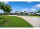 Community clubhouse with landscaped grounds and brick pavers at 4909 W Fountainwood Dr, St Cloud, FL 34772