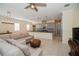 Living room features a sectional sofa and open concept design at 4909 W Fountainwood Dr, St Cloud, FL 34772