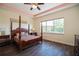Spacious bedroom with a large window and hardwood floors at 4909 W Fountainwood Dr, St Cloud, FL 34772