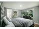 Main bedroom with a large bed and a view of the backyard at 1406 S Hoagland Blvd, Kissimmee, FL 34746
