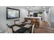 Dining area with a black table and chairs, open to the kitchen and living room at 1406 S Hoagland Blvd, Kissimmee, FL 34746