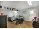 Small bedroom with glass top table and striped bedding at 1406 S Hoagland Blvd, Kissimmee, FL 34746