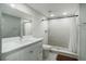 Contemporary bathroom with white vanity and walk-in shower at 1406 S Hoagland Blvd, Kissimmee, FL 34746