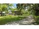 Relaxing picnic area with shaded tables under lush trees at 1406 S Hoagland Blvd, Kissimmee, FL 34746