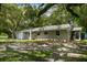 Ranch home with a large yard and mature trees at 1406 S Hoagland Blvd, Kissimmee, FL 34746