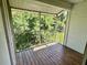 Screened balcony with wood decking and wooded views at 125 Reserve Cir # 205, Oviedo, FL 32765