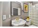 Modern bathroom with a white sink and glass block shower at 445 Hightower Dr, Debary, FL 32713