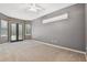 Bedroom with grey walls, carpet flooring, and pool access at 445 Hightower Dr, Debary, FL 32713