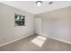 Spacious bedroom with tile floors and a closet at 803 Plumosa Ave, Fruitland Park, FL 34731