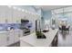 Modern kitchen with white cabinets and quartz countertops at 713 Silversmith Cir, Lake Mary, FL 32746