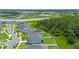 Aerial view of a house and neighborhood near a lake at 340 Citrine Loop, Kissimmee, FL 34758