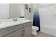 Clean bathroom with gray vanity, white countertop, and a shower/tub combo at 1676 Tropical Palms Cir, Kissimmee, FL 34747