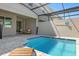 Enjoy this private pool with a covered patio and plenty of space for lounging at 1676 Tropical Palms Cir, Kissimmee, FL 34747