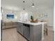 Open kitchen with gray cabinets and island at 1676 Tropical Palms Cir, Kissimmee, FL 34747