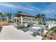 Relaxing community pool bar with shaded seating and a beautiful view at 1676 Tropical Palms Cir, Kissimmee, FL 34747