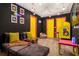 Playful game room with Pac-Personal decor, bean bag chair, and arcade game at 1676 Tropical Palms Cir, Kissimmee, FL 34747