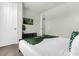 Bright bedroom with a queen bed and access to a nearby bathroom at 1676 Tropical Palms Cir, Kissimmee, FL 34747