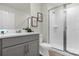 Bathroom with shower and grey vanity at 1676 Tropical Palms Cir, Kissimmee, FL 34747