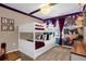 bedroom with bunk beds and jungle-themed wall at 1676 Tropical Palms Cir, Kissimmee, FL 34747