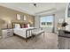 Spacious primary bedroom with large window and en-suite bathroom at 1676 Tropical Palms Cir, Kissimmee, FL 34747