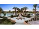 Community firepit with seating area and surrounding landscaping at 1676 Tropical Palms Cir, Kissimmee, FL 34747