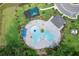 Unique shaped pool with surrounding lounge area and playground at 1335 Berry Ln, Davenport, FL 33837