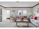 Bright living room with comfy sofas, a coffee table, and neutral decor at 18955 Se 107Th Pl, Ocklawaha, FL 32179