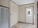 Laundry area with a door and plenty of wall space at 18955 Se 107Th Pl, Ocklawaha, FL 32179