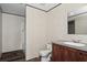 Bathroom with shower, toilet, vanity, and wood cabinets at 18955 Se 107Th Pl, Ocklawaha, FL 32179